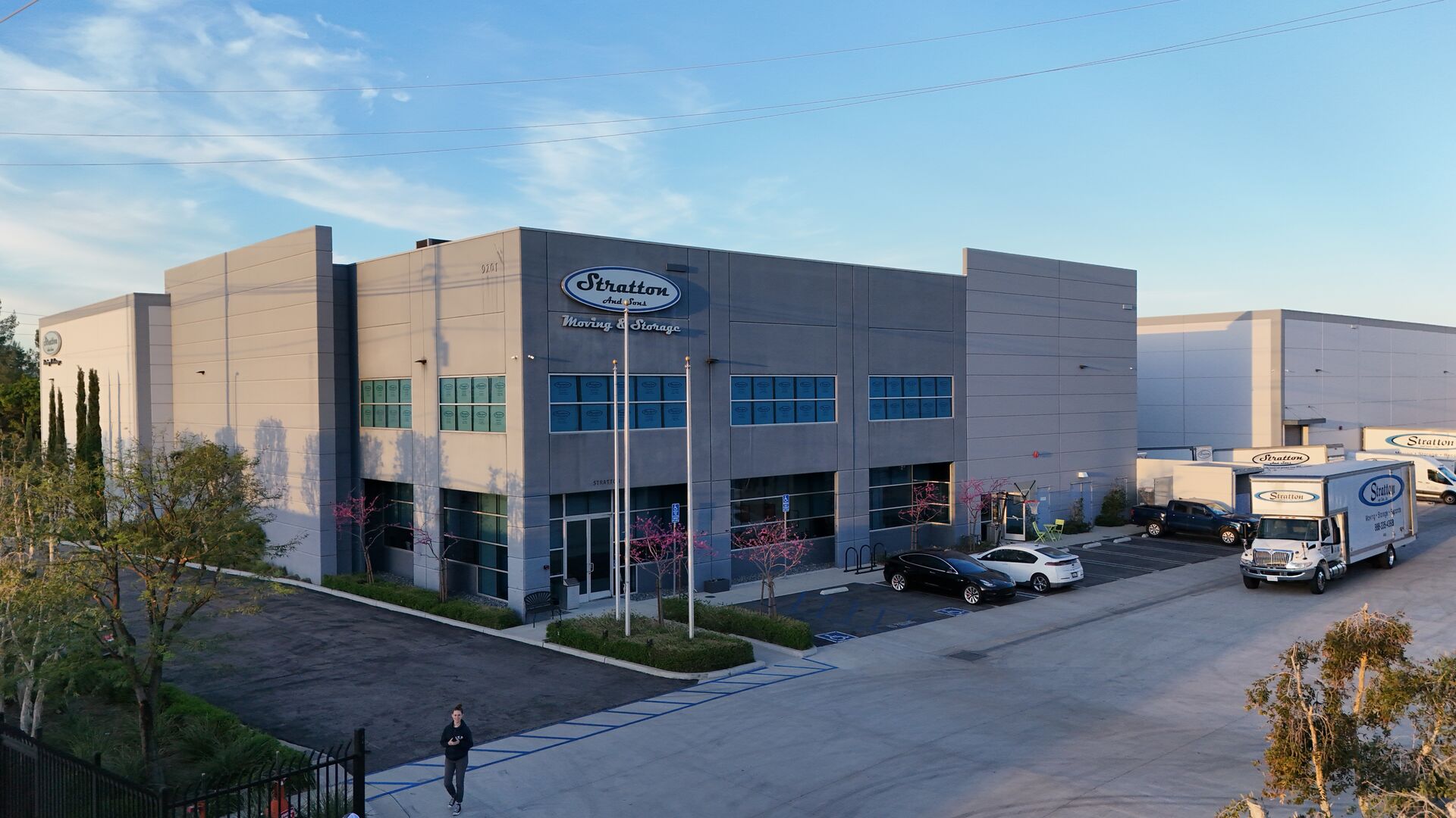 Stratton and Sons Moving and Storage headquarters building in Chatsworth, California with branded moving trucks parked outside